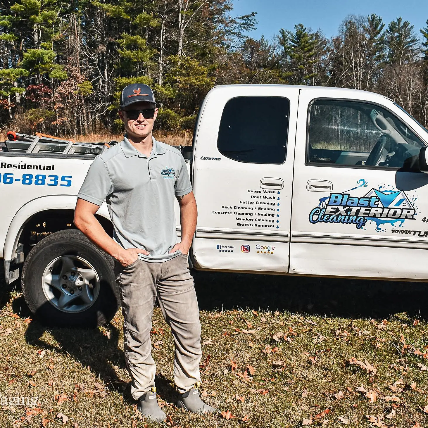 Hunter Rogers owner of Blast Exterior Cleaning is standing in front of his work truck