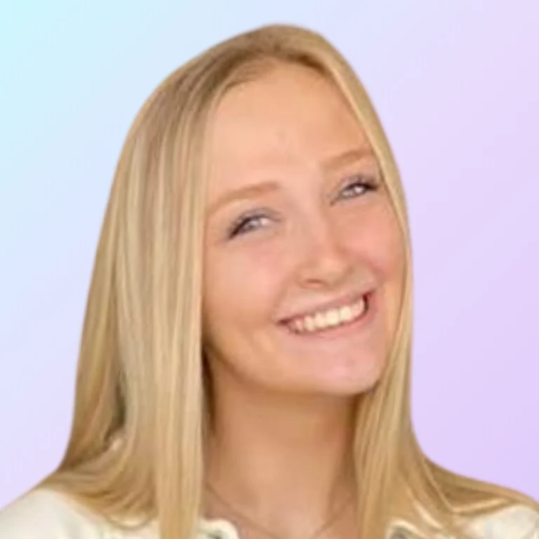 Starling Sturm, web designer at 828 Biz Marketing smiling and wearing a light cream colored top